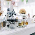 Laboratory microscope with glassware and scientific equipment for research and innovation