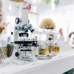 Laboratory microscope with glassware and scientific equipment for research and innovation